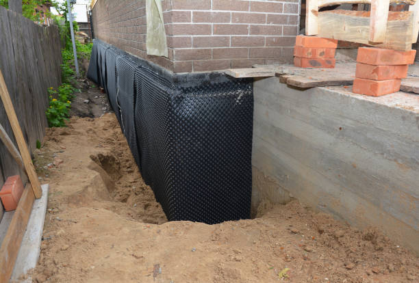 Happy homeowners after waterproofing job in Wabash